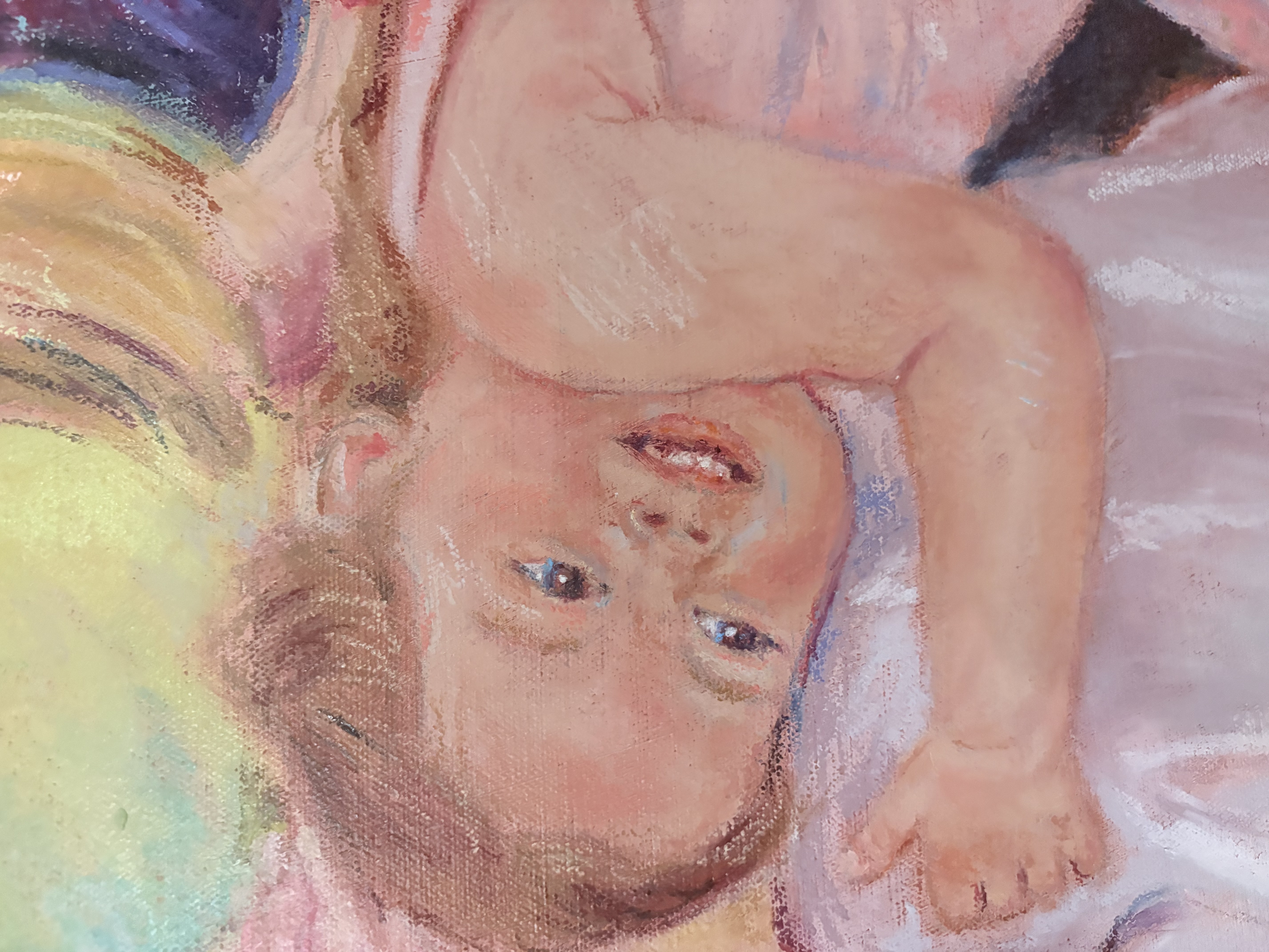 Portrait of a young child held in arms