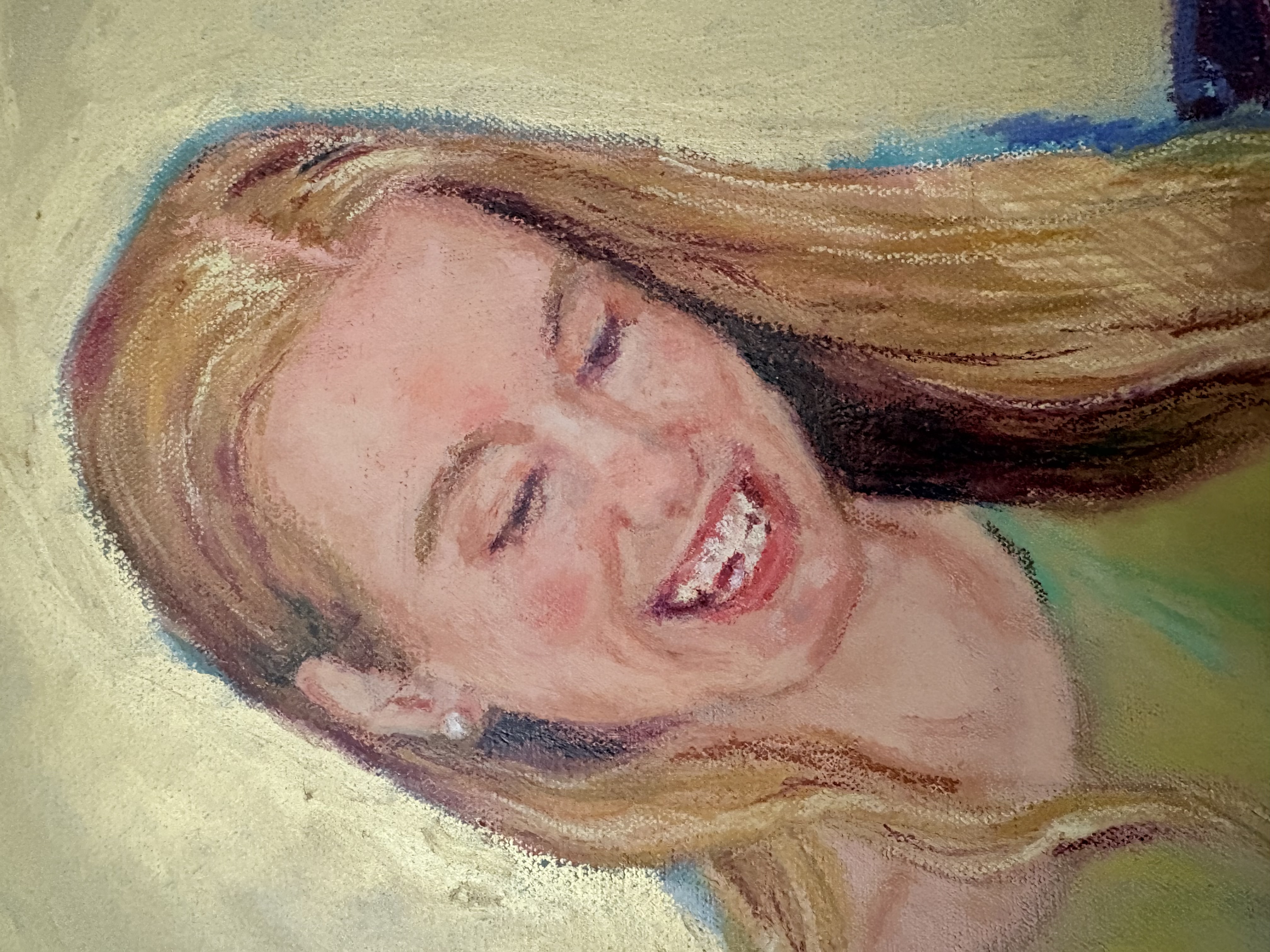 Portrait of a laughing woman with long blonde hair